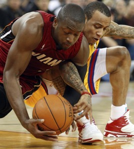Dwyane Wade and Monta Ellis fight for the ball during Wednesday's game.